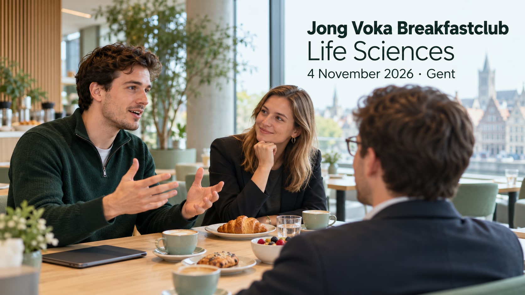 Business professionals discuss an idea over coffee in a bright breakfast space.