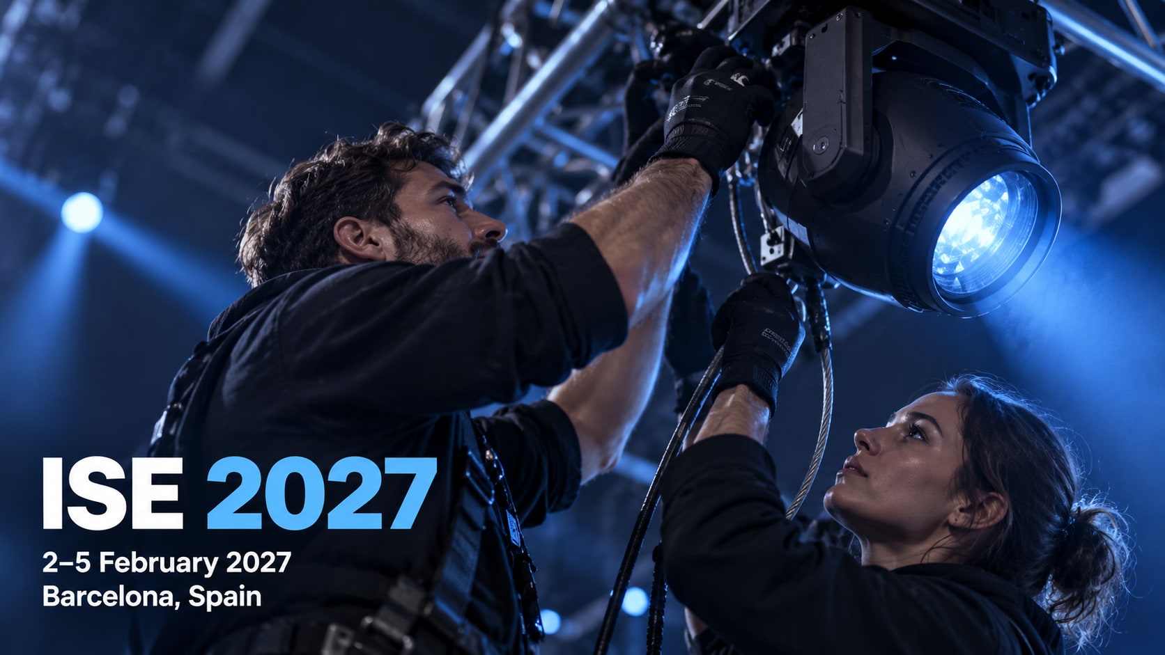Two audiovisual technicians adjusting a stage lighting fixture, with ISE 2027, 2–5 February and Barcelona shown in the cover.